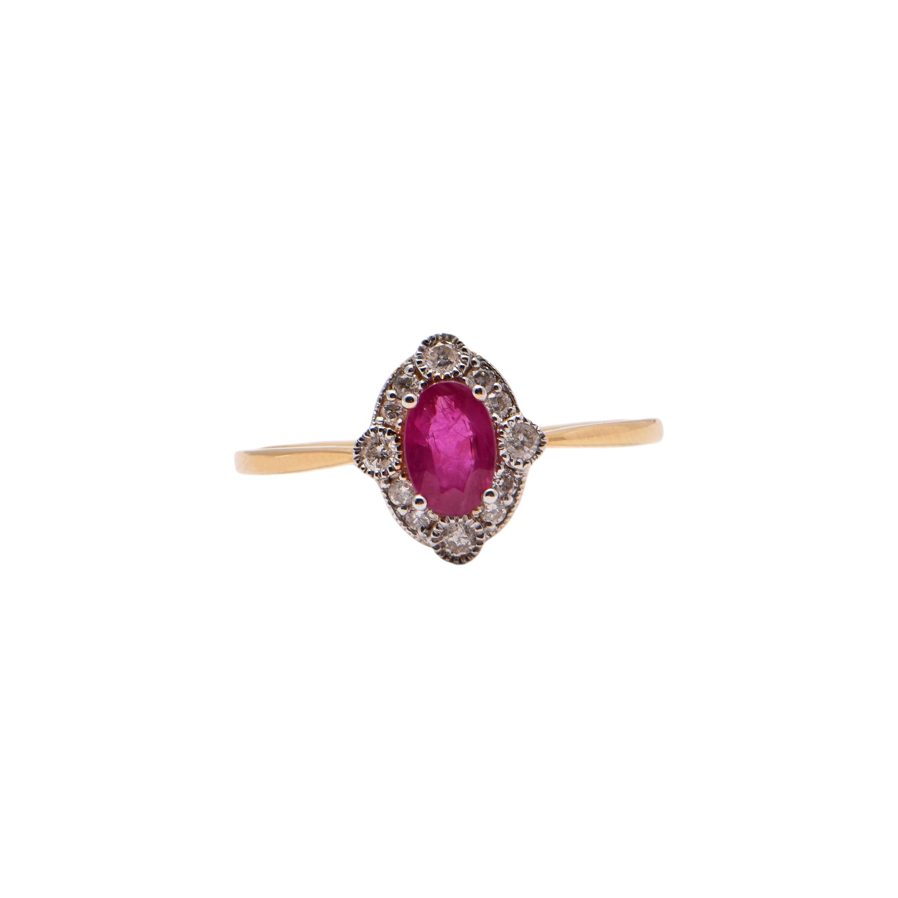 Oval Ruby and Round Diamond Halo Ring in 18 Carat Yellow Gold For Sale