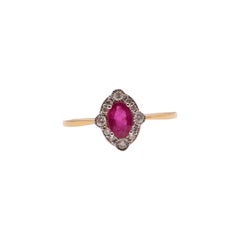 Oval Ruby and Round Diamond Halo Ring in 18 Carat Yellow Gold