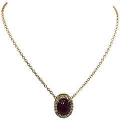 Oval Ruby Cabochon and Diamond Pendant Necklace in 18 Karat Yellow Gold