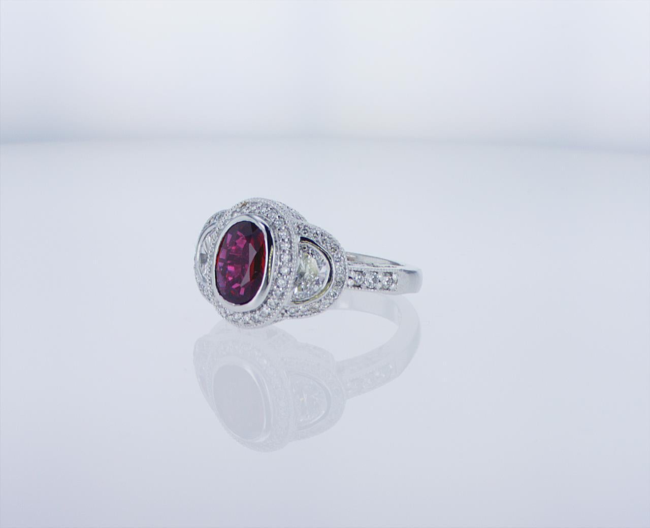 Modern Oval Ruby Cocktail Ring with Half Moon Diamond Accents For Sale