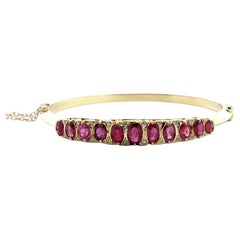 Oval Ruby Diamond 14 Karat Yellow Vintage Hinged Bangle Bracelet