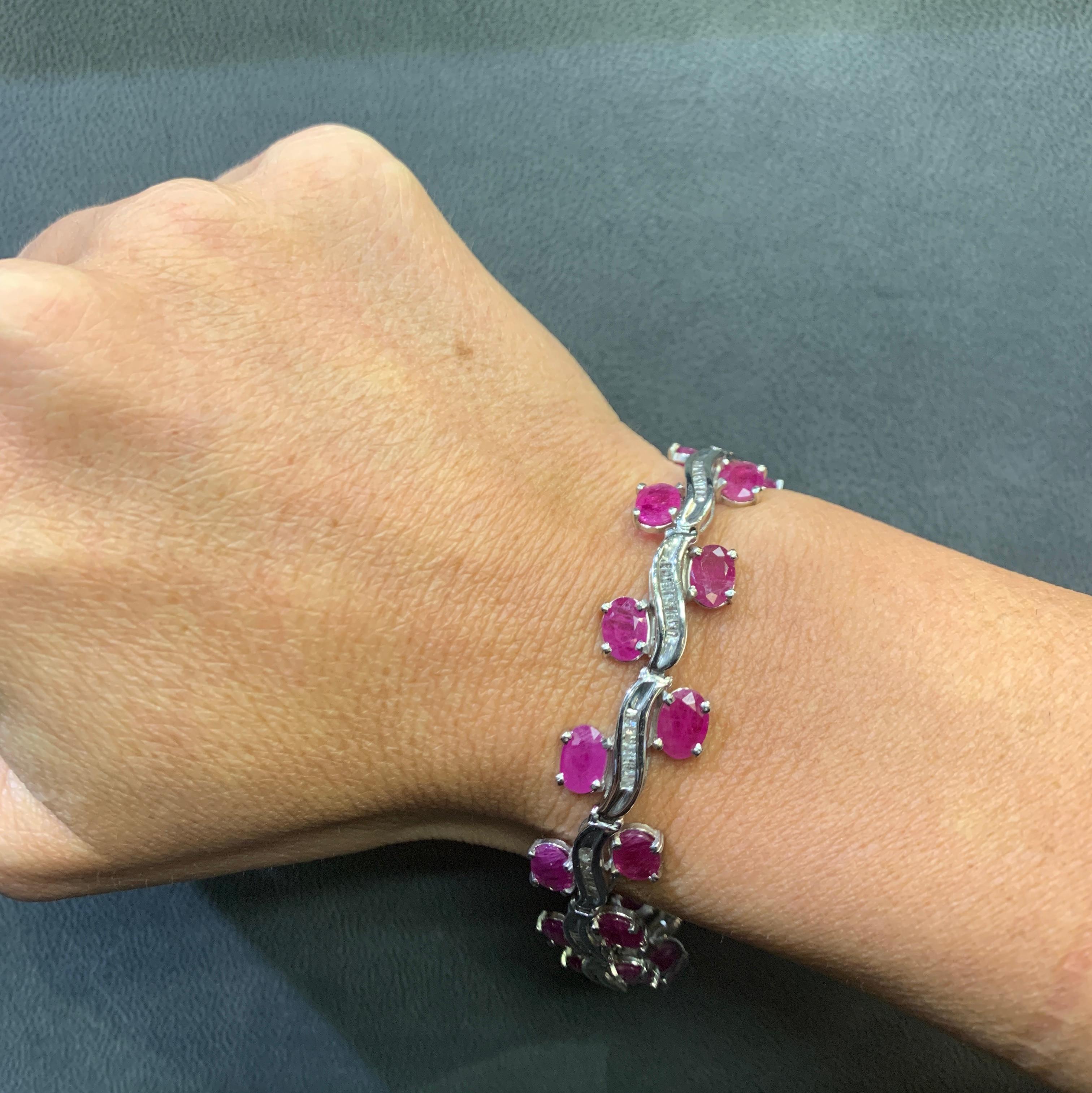  Oval Ruby & Diamond Bracelet

A bracelet featuring  two rows of oval cut rubies set with a row of baguette cut diamonds. 

Measurements: 7.5