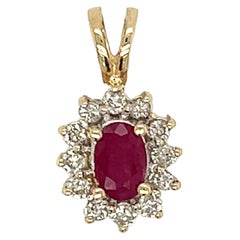 Oval Ruby & Diamond Halo Pendant in 14K Yellow Gold 
