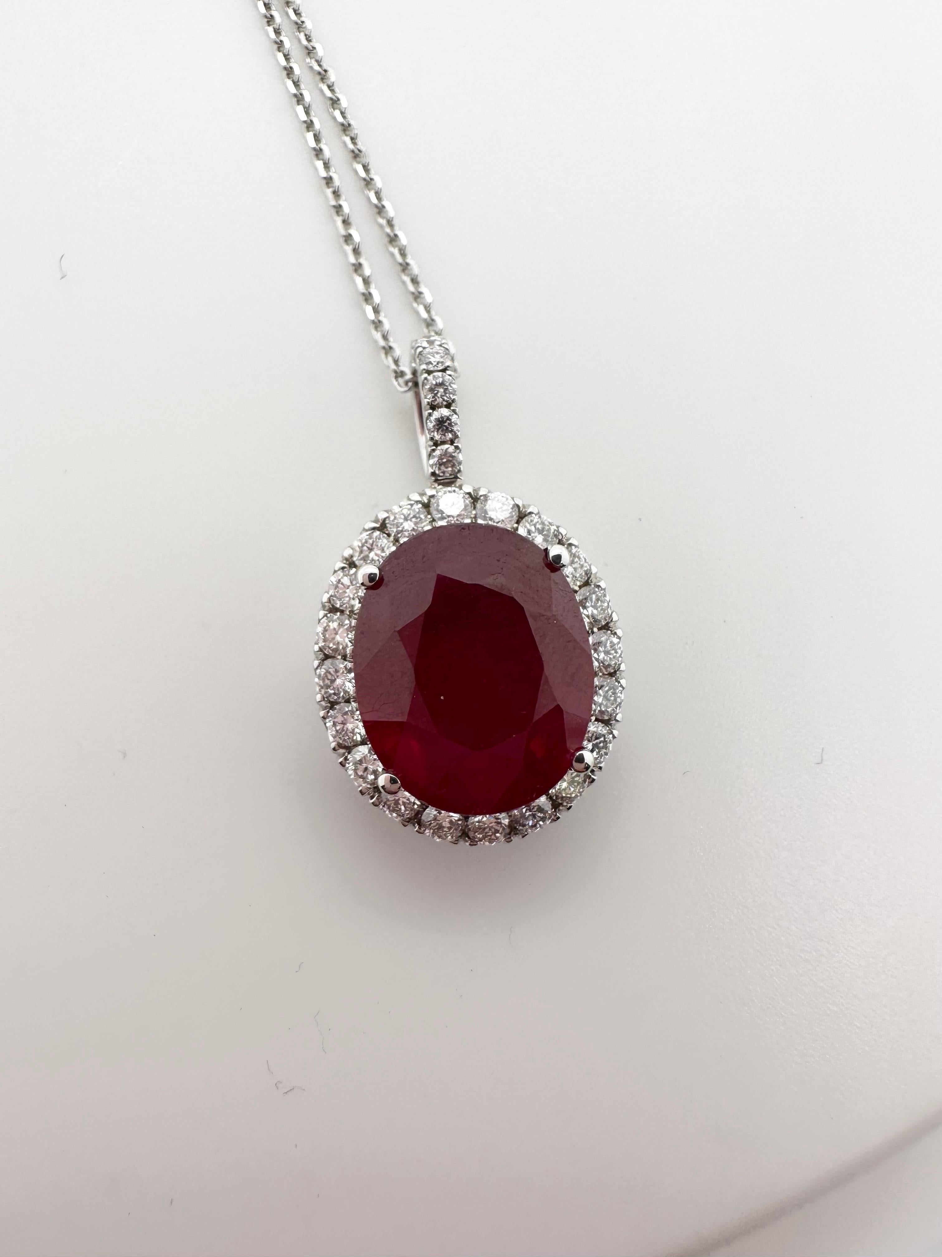Ruby pendant necklace made in 18Kt white gold, chain is 18 inches. Ruby is a stunning red color, 100% natural but enhanced. 

Metal Type: 14KT
Rubies:7.15ct ct approximately (natural but enhanced)
Natural Diamond(s): 
Color: F-G-H
Cut:Round