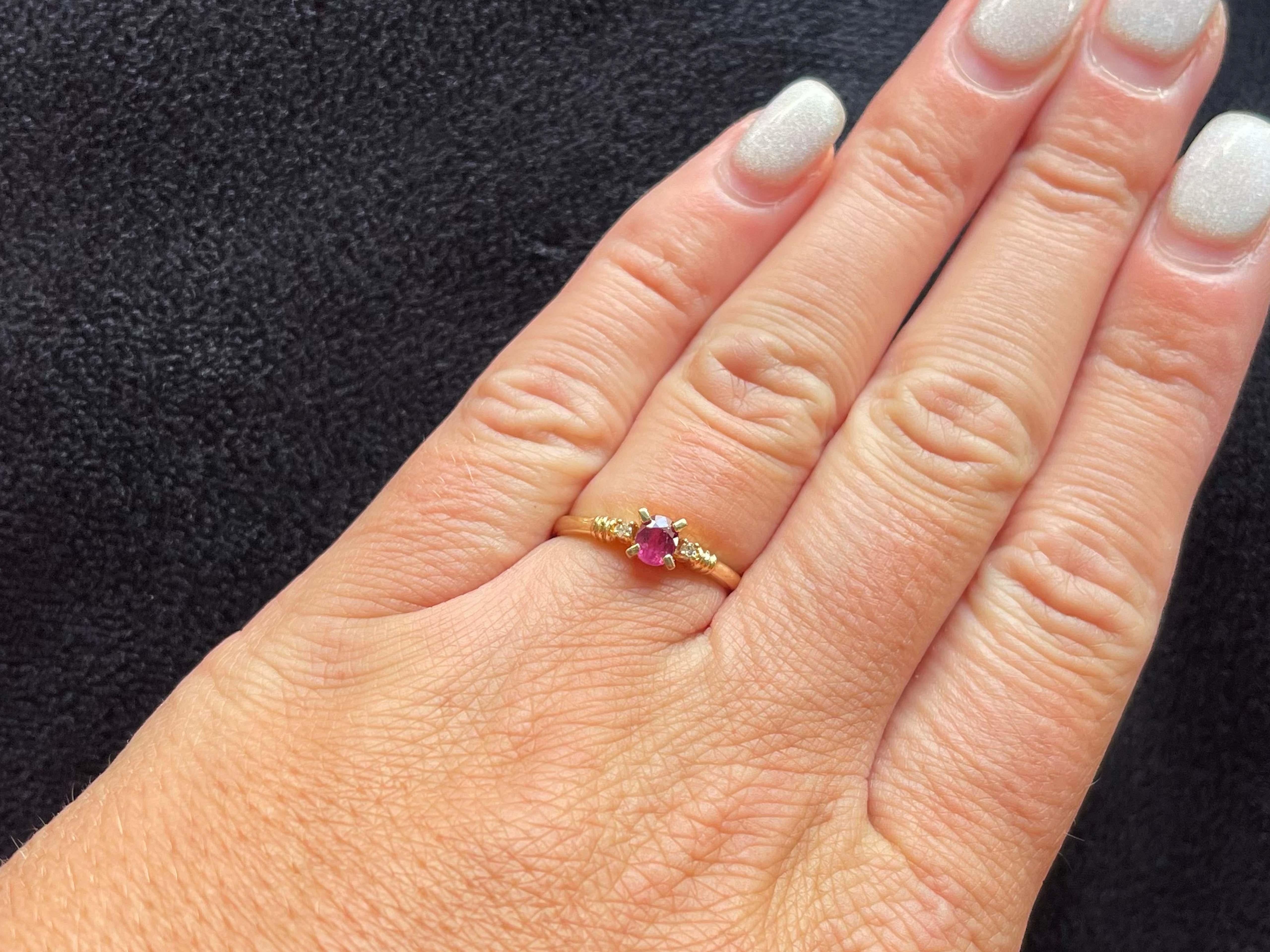 Item Specifications:

Metal: 14K Yellow Gold

Style: Statement Ring

Ring Size: 5.75 (resizing available for a fee)

Total Weight: 1.6 Grams

Gemstone Specifications:

Gemstones: 1 oval red ruby

Ruby Carat Weight: 0.20 carats

Diamond Carat Weight: