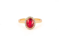 Oval ruby, diamonds 14k gold.