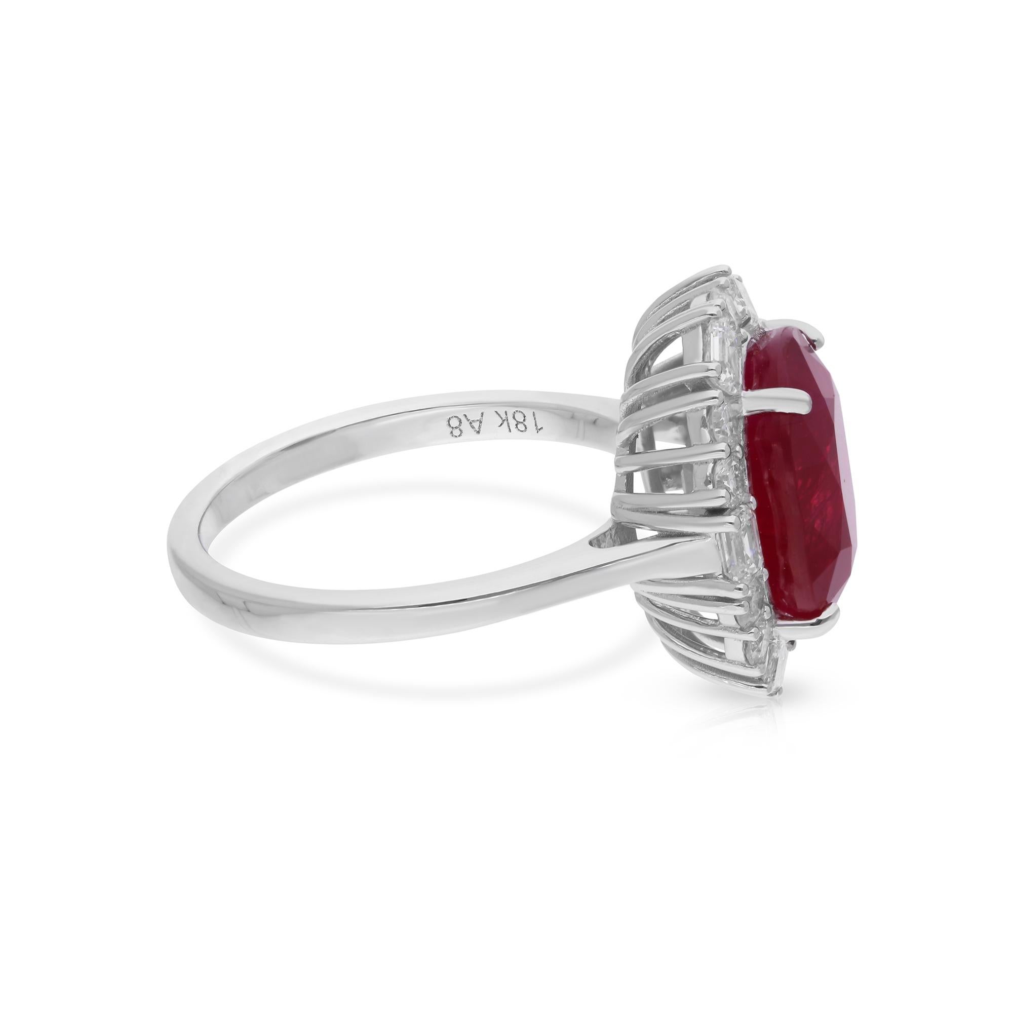 Immerse yourself in the world of refined luxury and timeless sophistication with this breathtaking Oval Ruby Gemstone Cocktail Ring, adorned with diamonds and meticulously crafted in 18 Karat White Gold. Handmade by skilled artisans, this exquisite