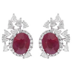 Clous d'oreilles en or blanc 14 carats avec pierres précieuses rubis ovales et diamants, fabrication artisanale