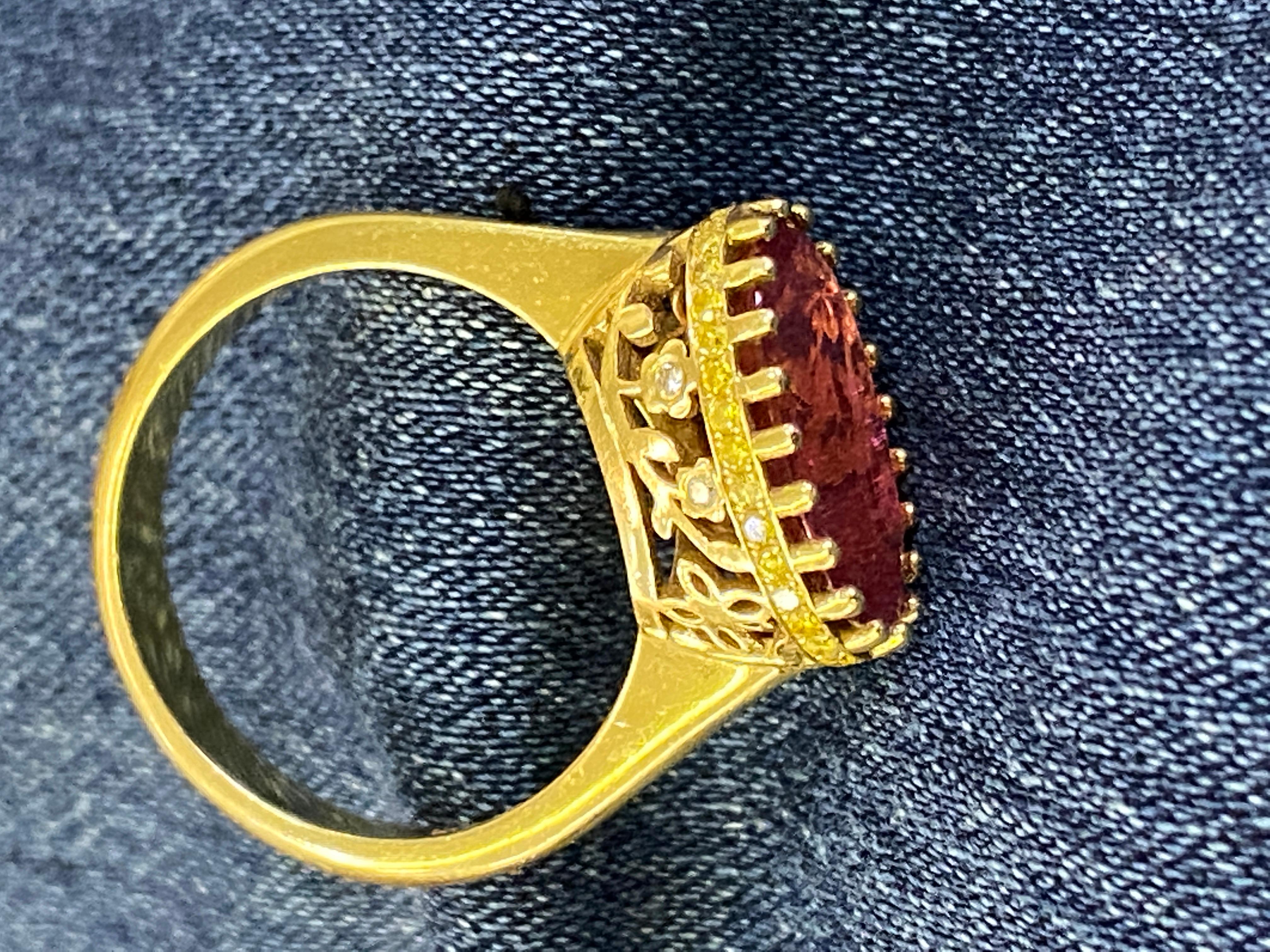 18k yellow gold ring with oval ruby-pink tourmaline and yellow diamonds. Size 7.25