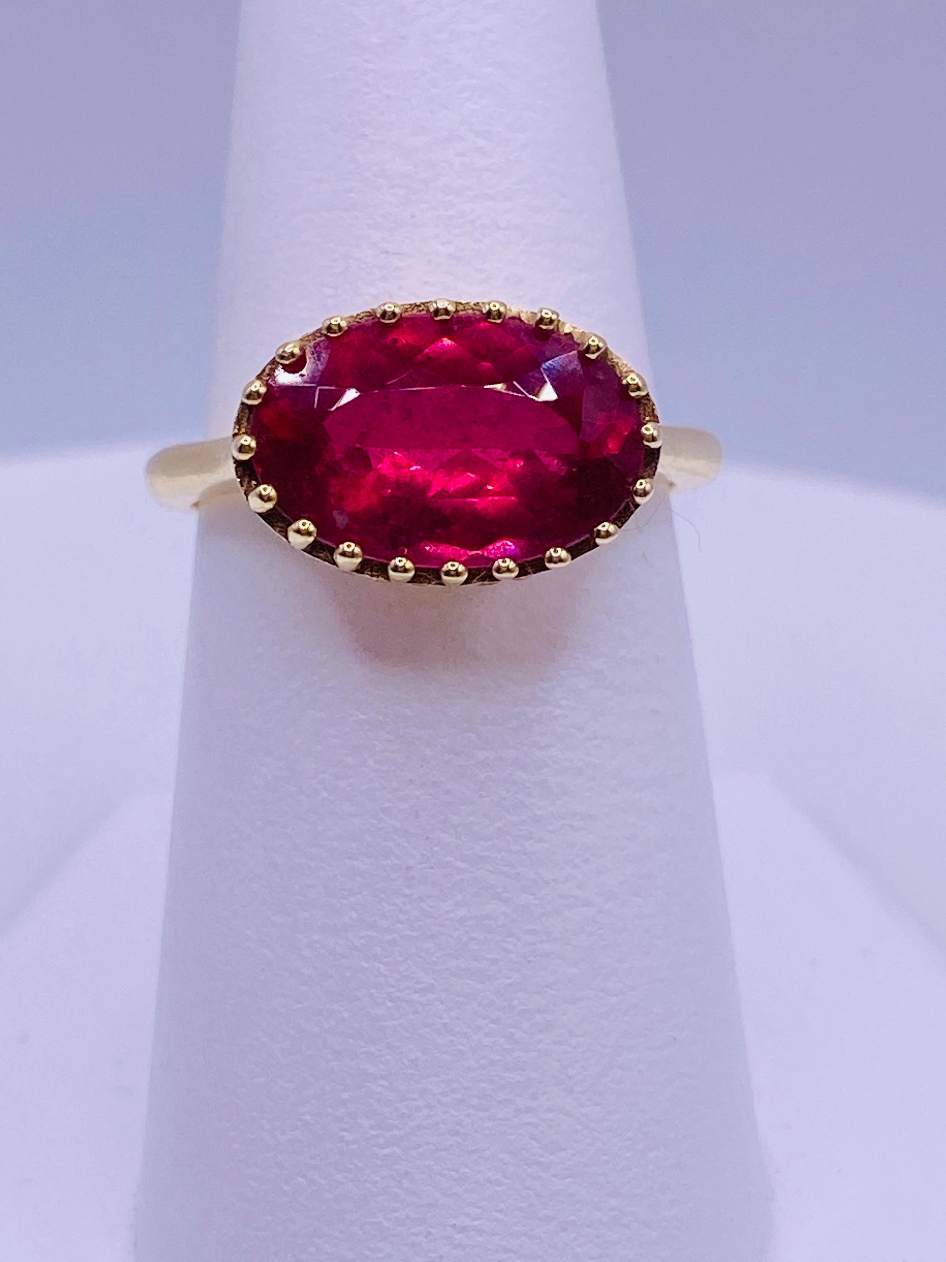 Women's or Men's Oval Ruby-Pink Tourmaline and Yellow Diamond Ring For Sale