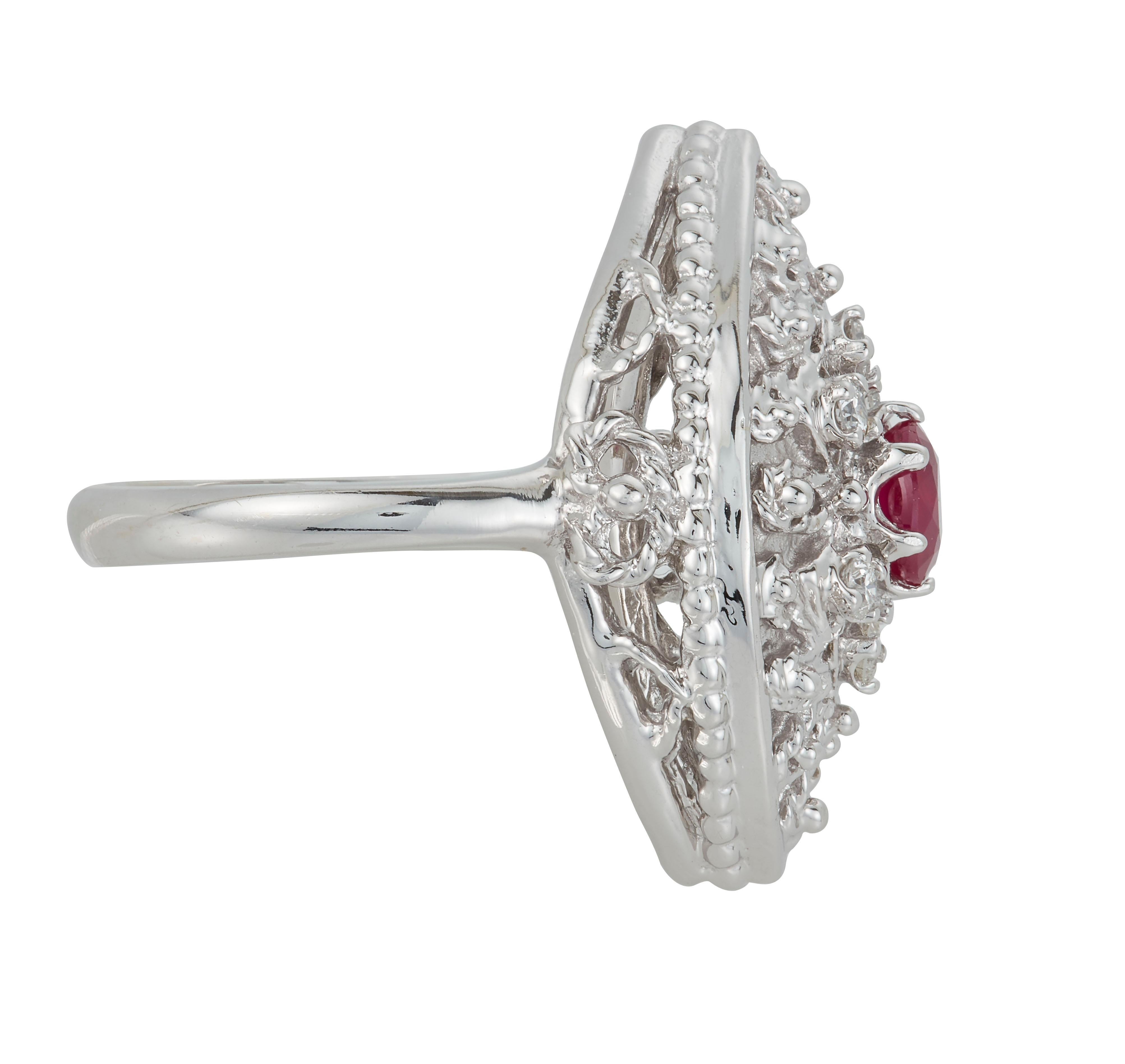 Metal: 14K White Gold
Center Stone: 1 Oval Ruby 0.57 carats - measuring 4.2 x 5 millimeters
Side Stones: 6 Round Brilliant White Diamonds at 0.19 carats total weight
Clarity: SI / Color: H-I

Fine one-of-a-kind craftsmanship meets incredible quality