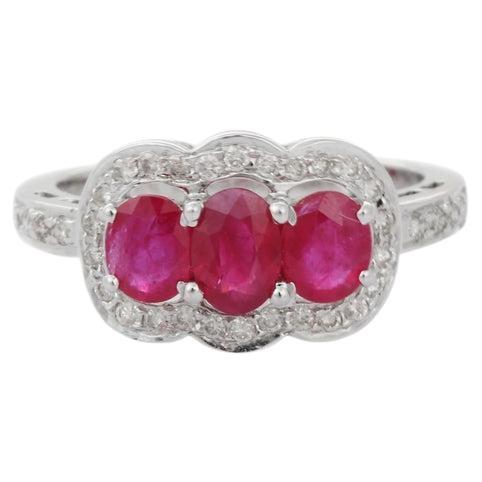 Oval Ruby Three Stone Engagement Ring in 18k White Gold with Diamonds
