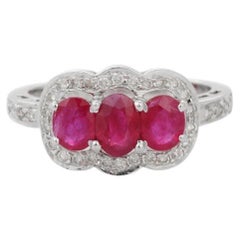 Oval Ruby Three Stone Engagement Ring in 18k White Gold with Diamonds
