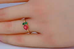Oval ruby, tsavorite and diamonds 14k gold ring.