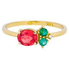 Oval ruby, tsavorite and diamonds 14k gold ring.
