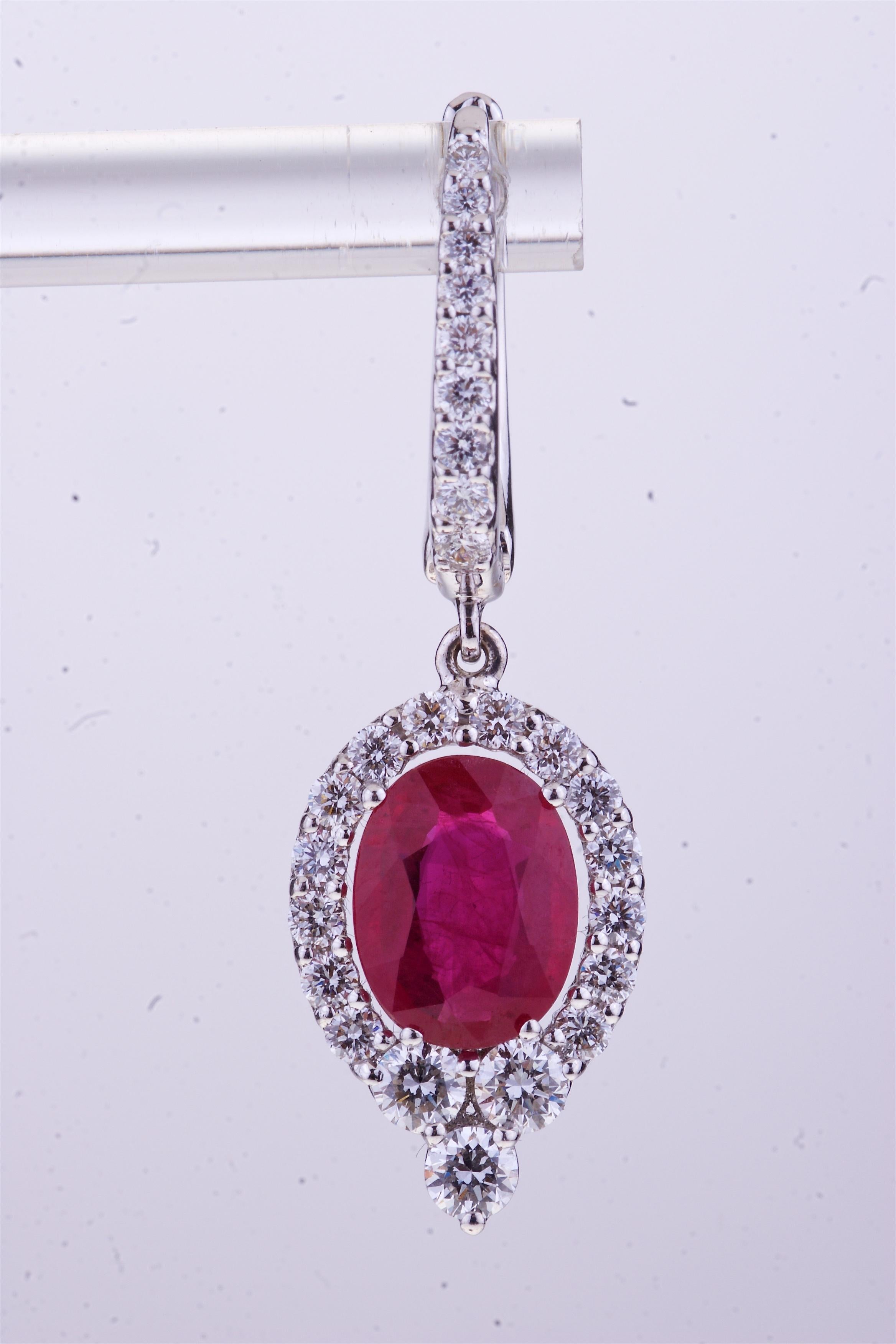 Oval Ruby with Round Diamonds White Gold Pendant Earrings.
Excellent Pair of Oval Ruby (ct. 2.52) and diamonds (ct. 1.02) for Elegant White Gold Pendant Earrings.
18kt gold weight is grams 5.40.
Designed and Manufactured in Italy. 
Angeletti Boasts