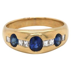Oval Sapphire and 0.20 CTW Diamond Band in 18K