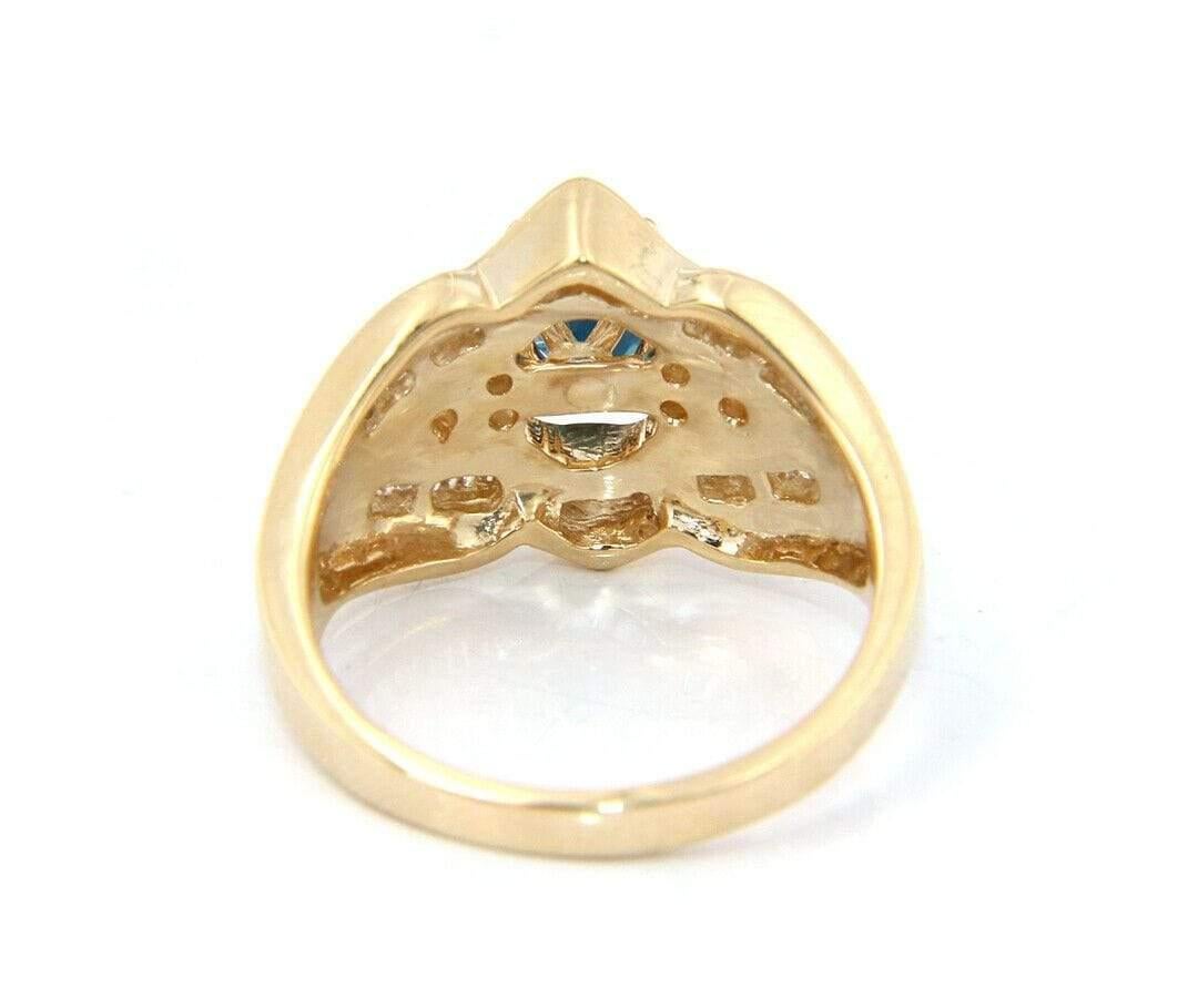 Oval Cut Oval Sapphire and Baguette Diamond Ring in 14K Yellow Gold For Sale