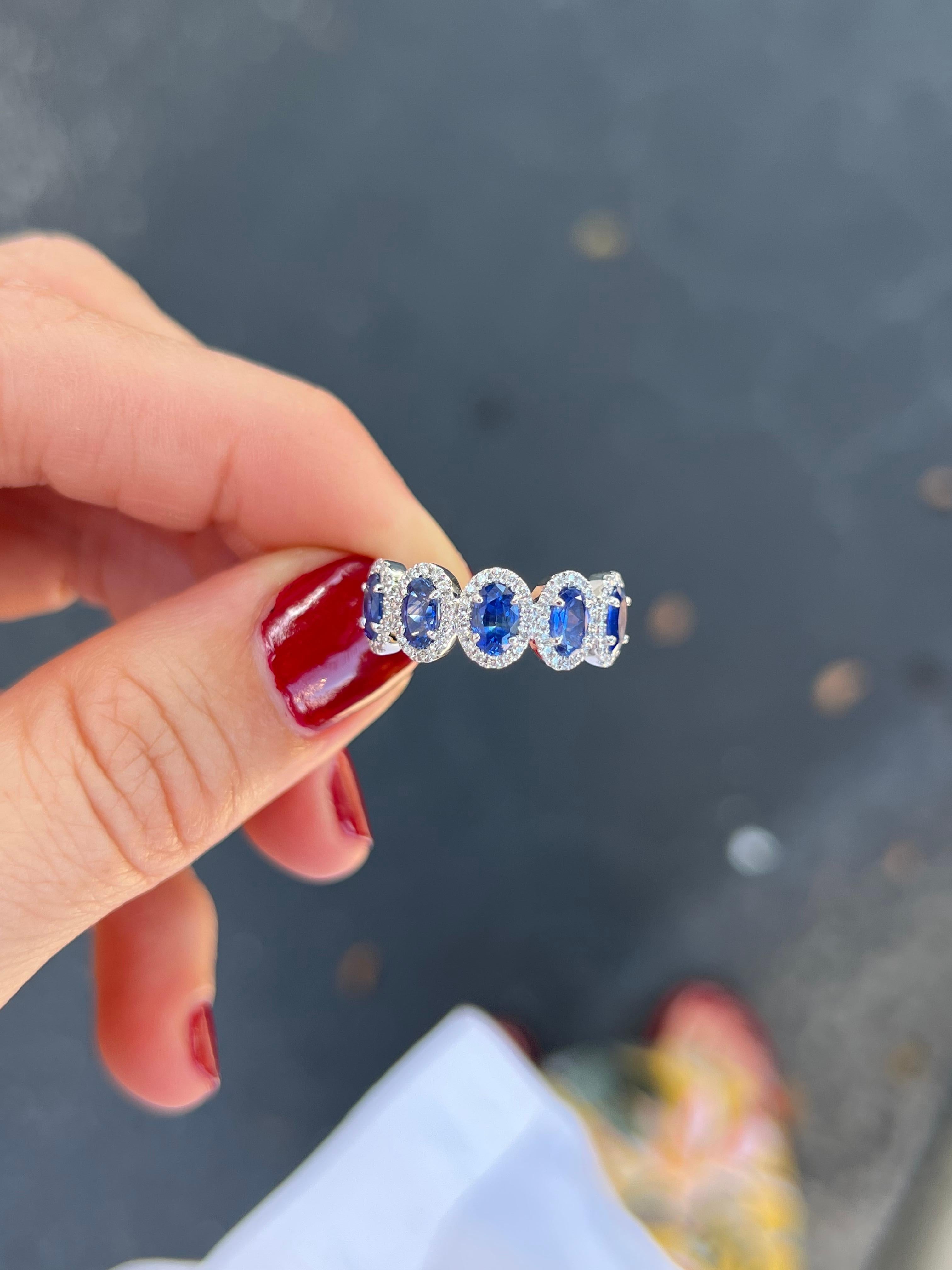 Platinum band with 2 carats total weight of oval sapphires and .27 carats in diamonds. 

Features
Platinum Mounting
5 oval sapphires for a combined 2 carats total weight in sapphires
.27 carat total weight in diamonds
Band width is 7.5 mm, tapering