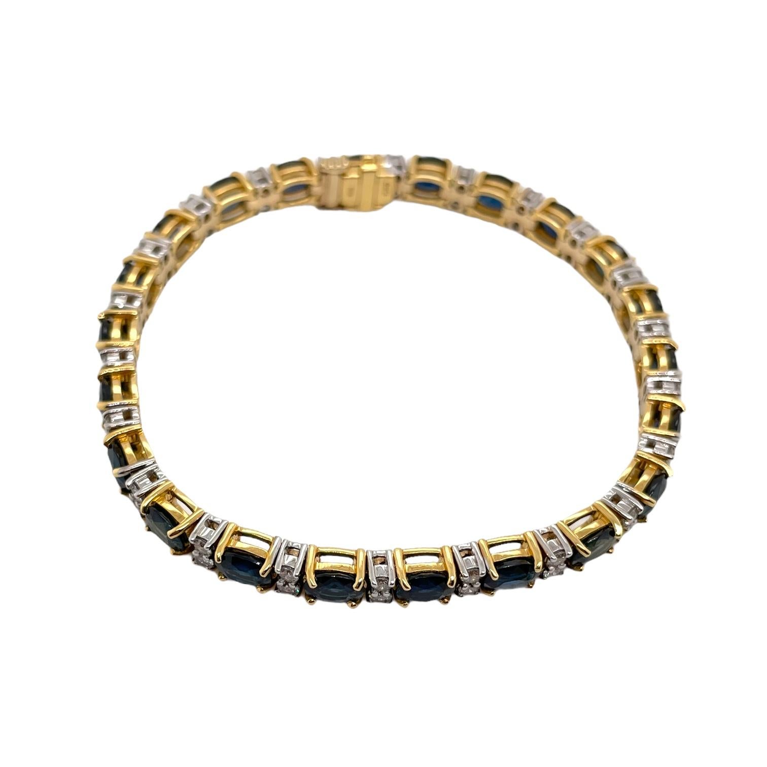 Straight row oval sapphire and diamond bracelet in 18k yellow and white gold. Bracelet contains 22 matching oval sapphires 13.25tcw and 44 round brilliant diamond 1.55tcw. Diamonds are colorless and VS2 in clarity. All stones are mounted in a