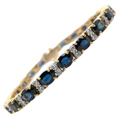 Armband mit ovalem Saphir und Diamant aus 18 Karat Gelb- und Weißgold