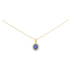 Oval Sapphire and Diamond Cluster Pendant in 18 Karat Yellow Gold
