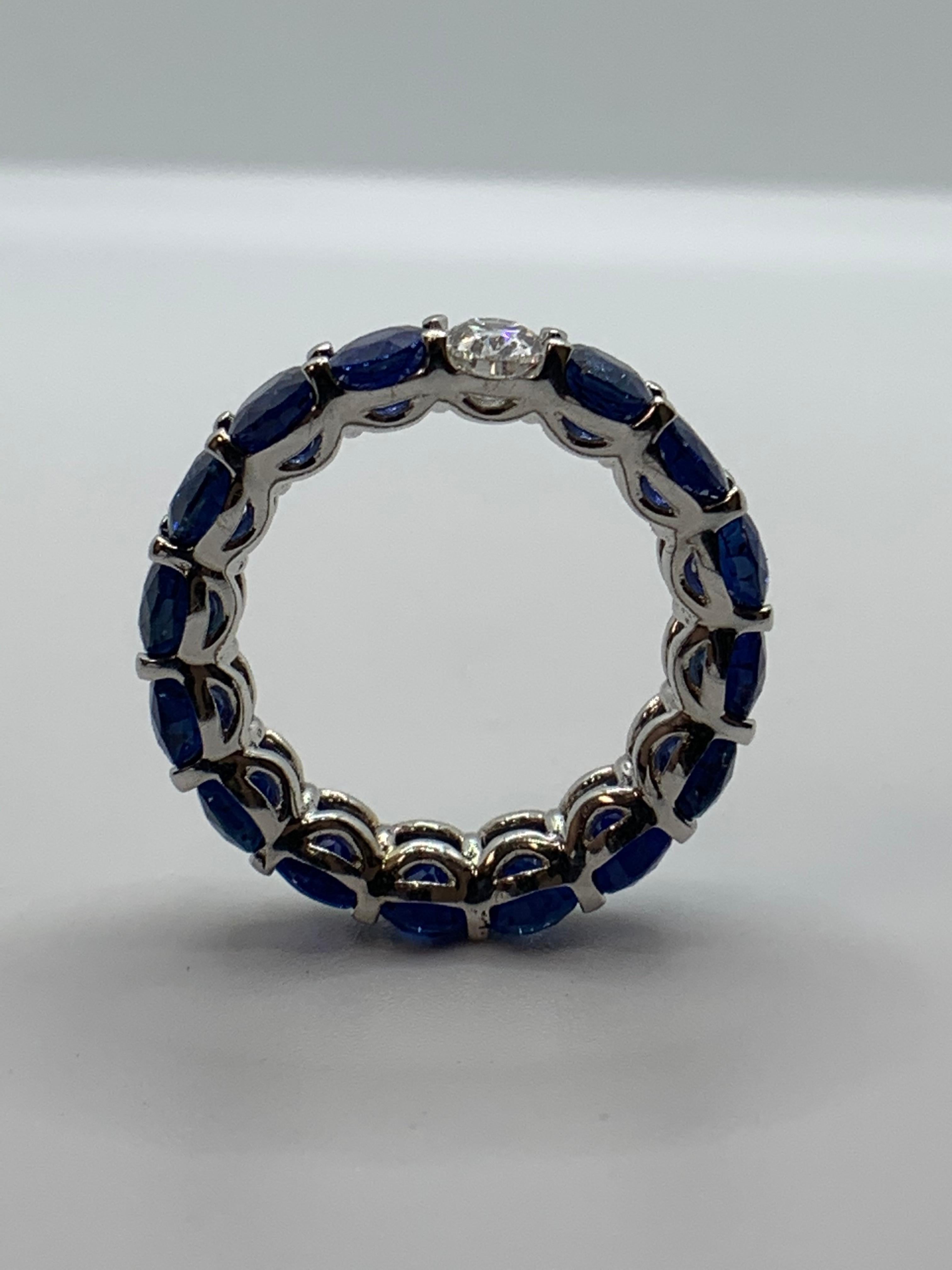 Beautiful and Forward Eternity Band.
Ring features 15 perfectly matched Oval shaped Sapphires weighing 8.49 Carats and
1 Oval Diamond weighing 0.47 Carats.
Set in 18 Karat White Gold.
Size 5.5.
Can be worn Diamond Side up or down.