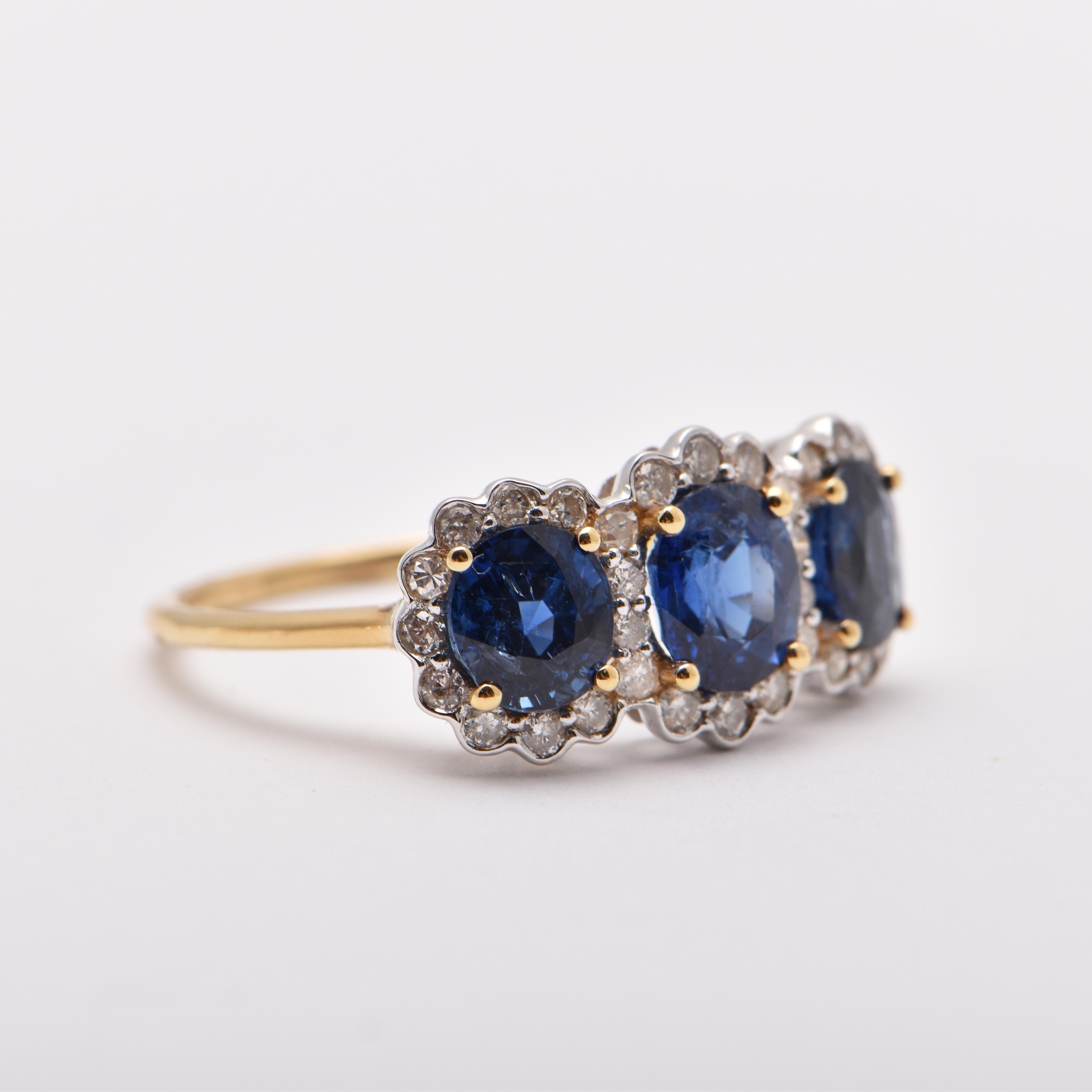 Oval Sapphire and Diamond Halo Trilogy Ring in 18 Carat Yellow Gold by Cartmer Jewellery

Size N

3 Sapphires totalling 2.61 Carats
32 Diamonds totalling 0.37 Carats
18 Carat White Gold Ring

FREE express postage usually 3-4 days Sydney to New