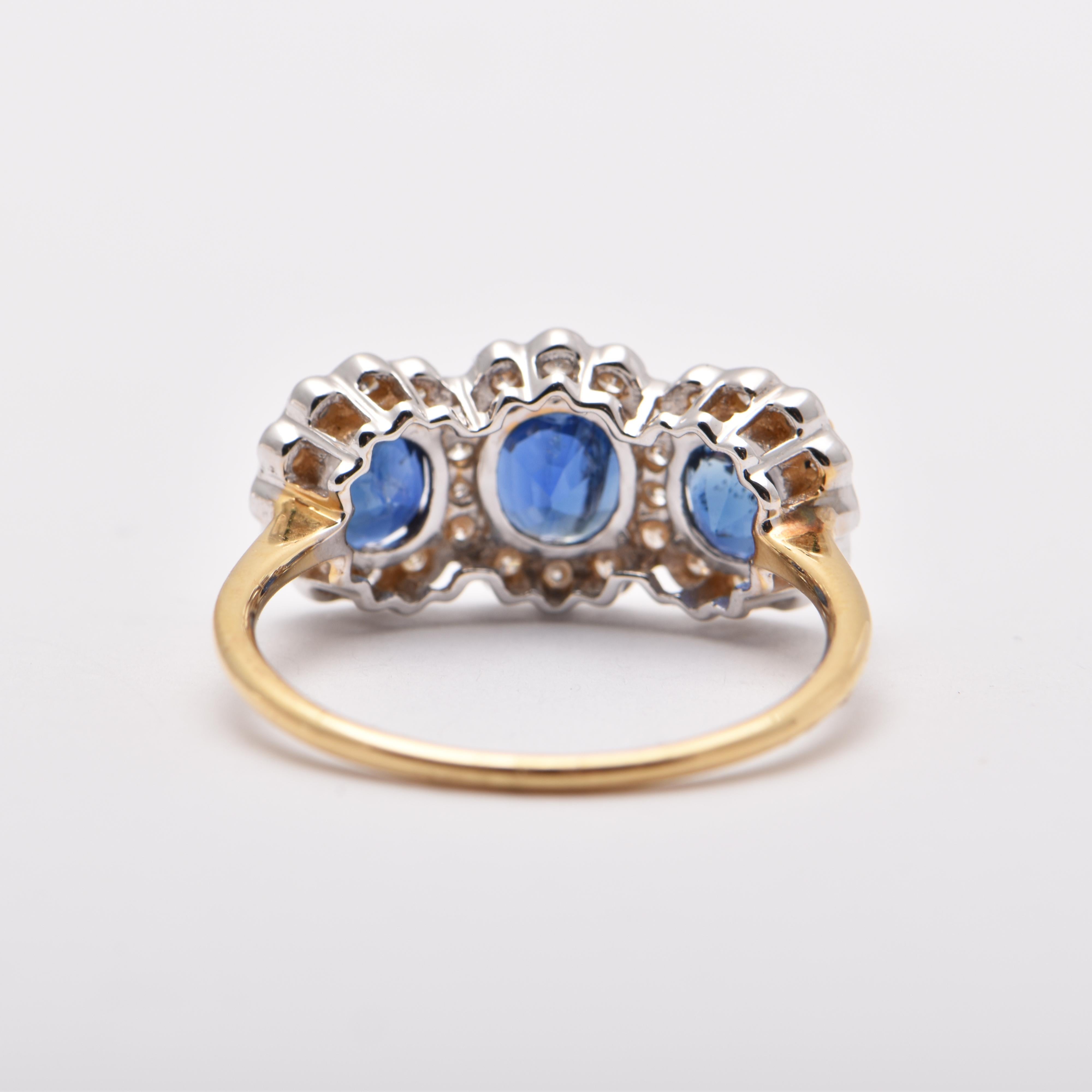 Oval Sapphire and Diamond Halo Trilogy Ring in 18 Carat Yellow Gold In New Condition For Sale In Sydney, AU