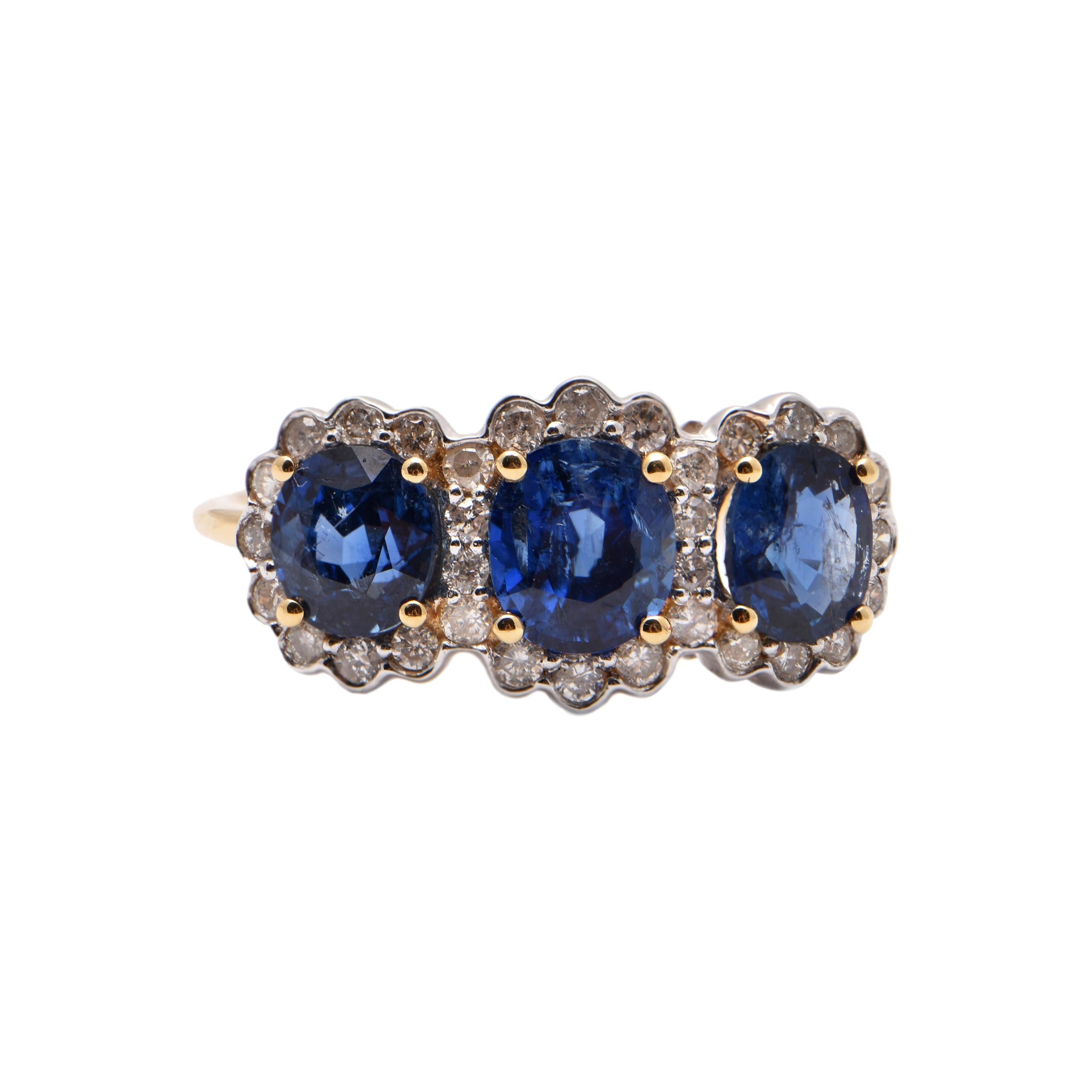 Oval Sapphire and Diamond Halo Trilogy Ring in 18 Carat Yellow Gold For Sale