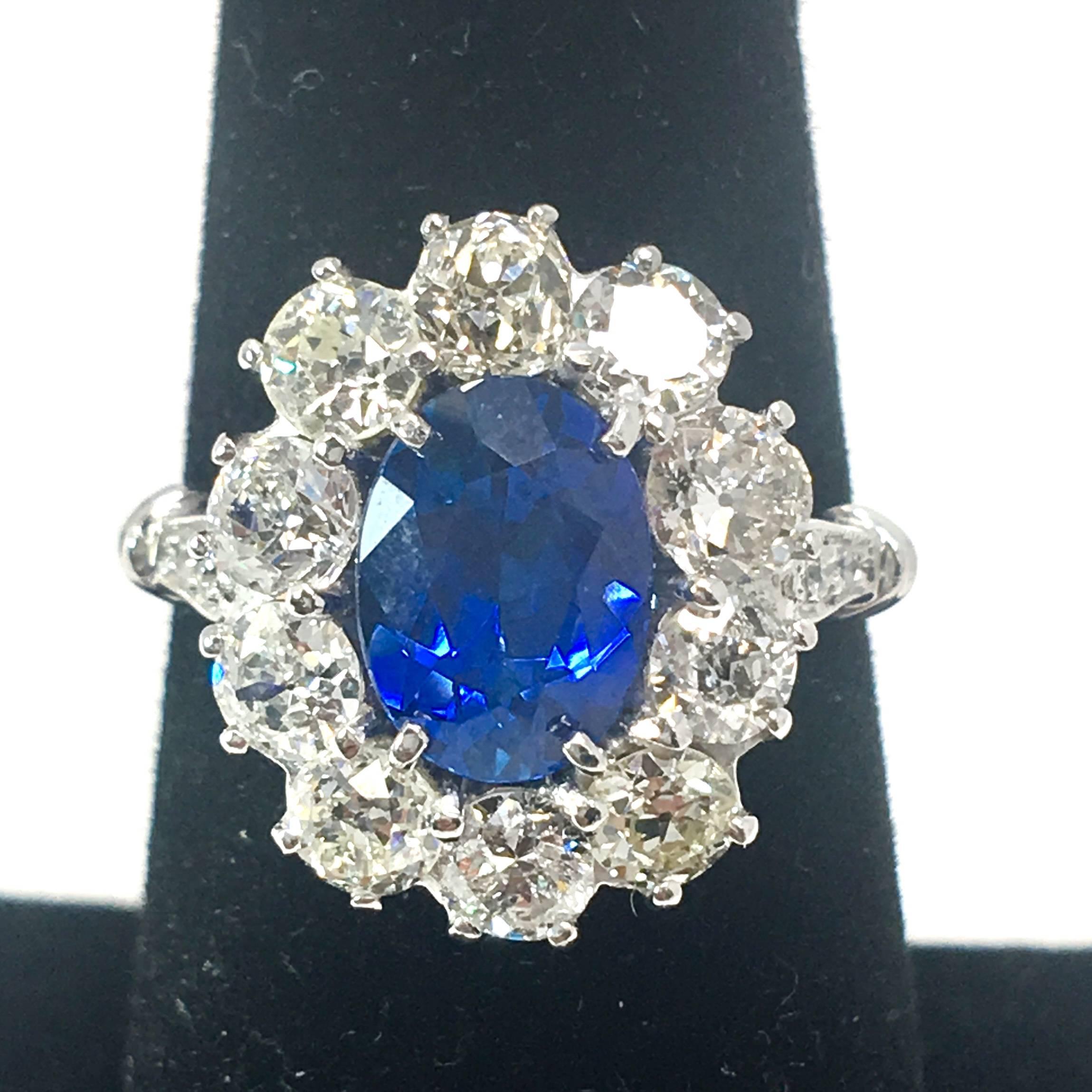 For sale is a gorgeous Platinum lady’s Diamond and Sapphire ring! 
Showcasing one (1) Oval natural blue Sapphire, four prong set, measuring 8.89 x 6.54 x 4.28 mm, weighing approximately 1.92 carats. 
The sapphire is surrounded by a beautiful halo of