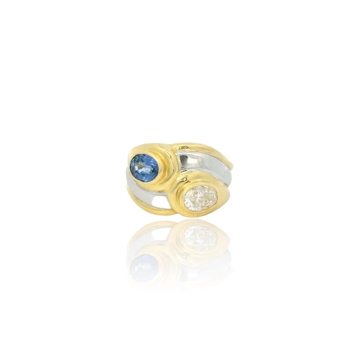 Anillo vintage de los años 80.

Anillo bicolor de oro blanco y amarillo de 18 quilates engastado con un zafiro azul de Ceilán ovalado de aproximadamente 1,00 quilates y un diamante ovalado de aproximadamente 0,85 quilates (color estimado I -