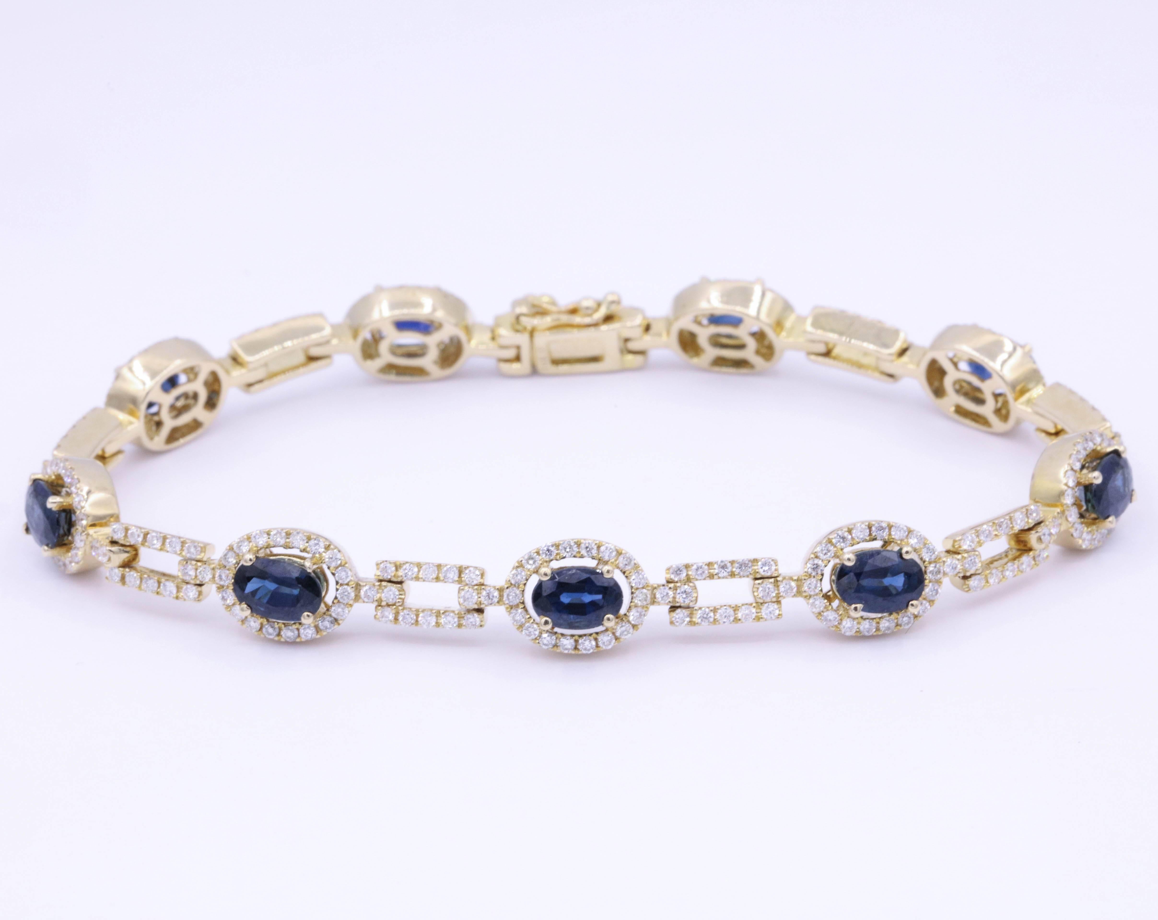 9 Sapphire each one  6x4 mm Total Weight 6.64 Carats
Diamonds: 1.99 Carats
14K Yellow Gold