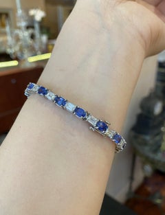 Oval Sapphire and Emerald cut Diamond Line Tennis Bracelet in Platinum