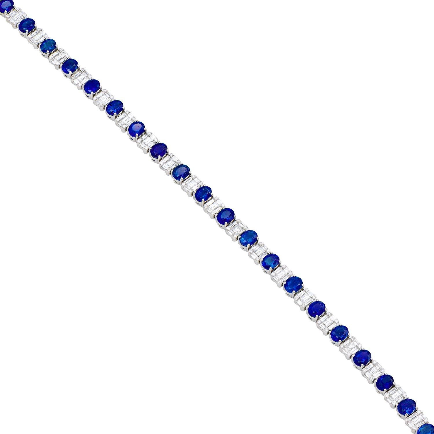 This truly gorgeous sapphire and diamond bracelet is made from 21 oval Ceylon blue sapphires totalling 8 carats that alternate with diamonds set to look like emerald-cut diamonds. They are made from 105 baguettes and 84 round diamonds which total