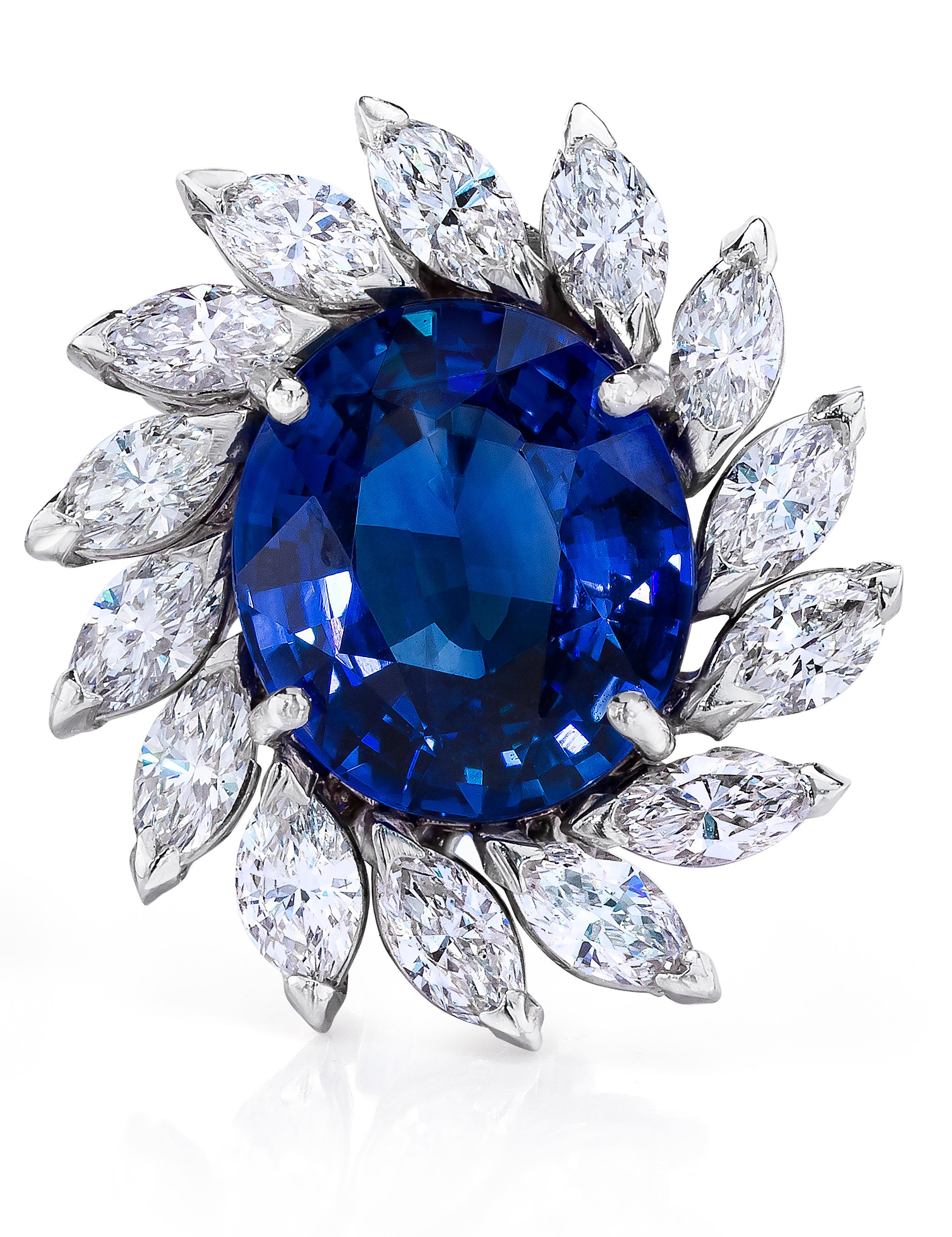 Ceylon Oval Shaped Sapphires weighing 8.90 Carats surrounded by Marquise Cut Diamonds weighing 2.26 Carats.
Set in 18 Karat White Gold.