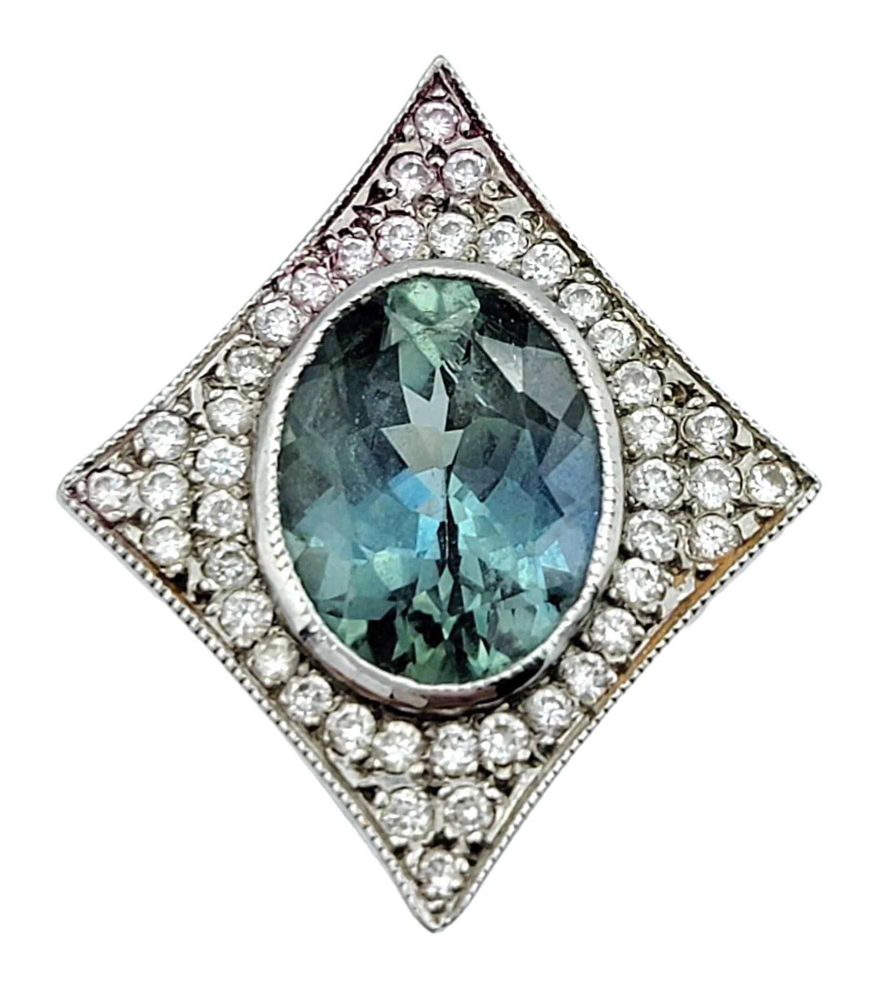 This exquisite pair of stud earrings featuring oval greenish-blue sapphires are elegantly set in 14 karat white gold. Each stunning sapphire is surrounded by a 4 point star shaped pavé diamond frame, adding a touch of brilliance and sophisticated