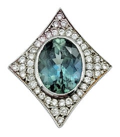Oval Sapphire and Pavé Diamond 4 Point Star Stud Earrings in 14 Karat White Gold