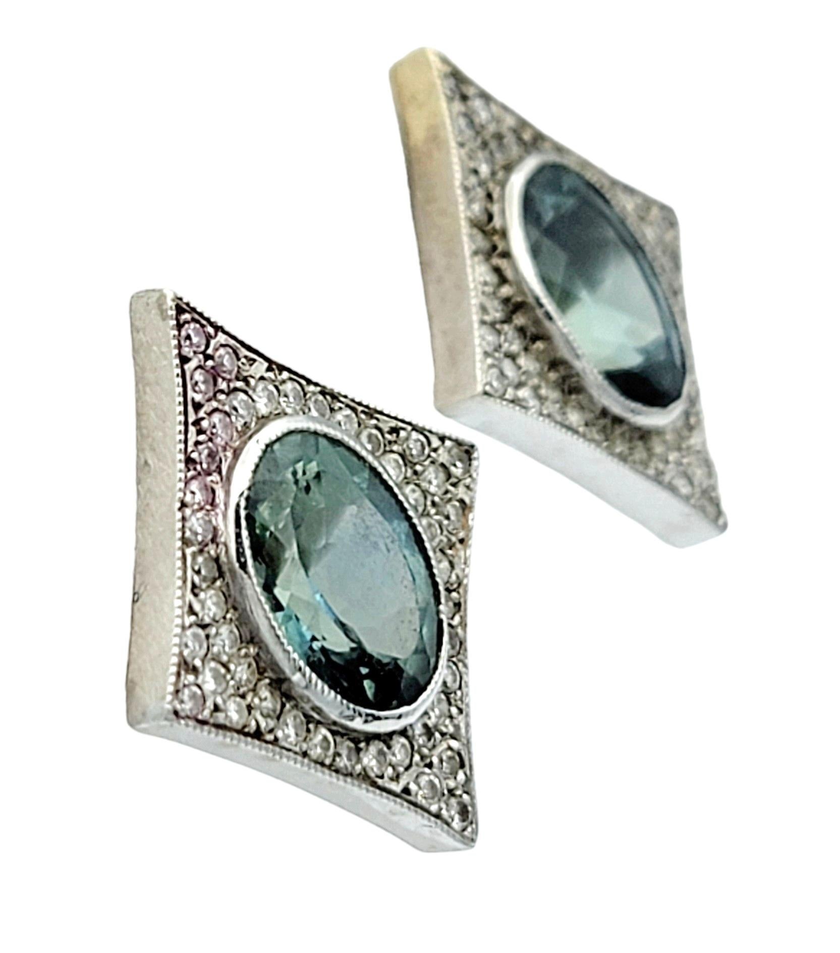 Contemporary Oval Sapphire and Pavé Diamond 4 Point Star Stud Earrings in 14 Karat White Gold For Sale