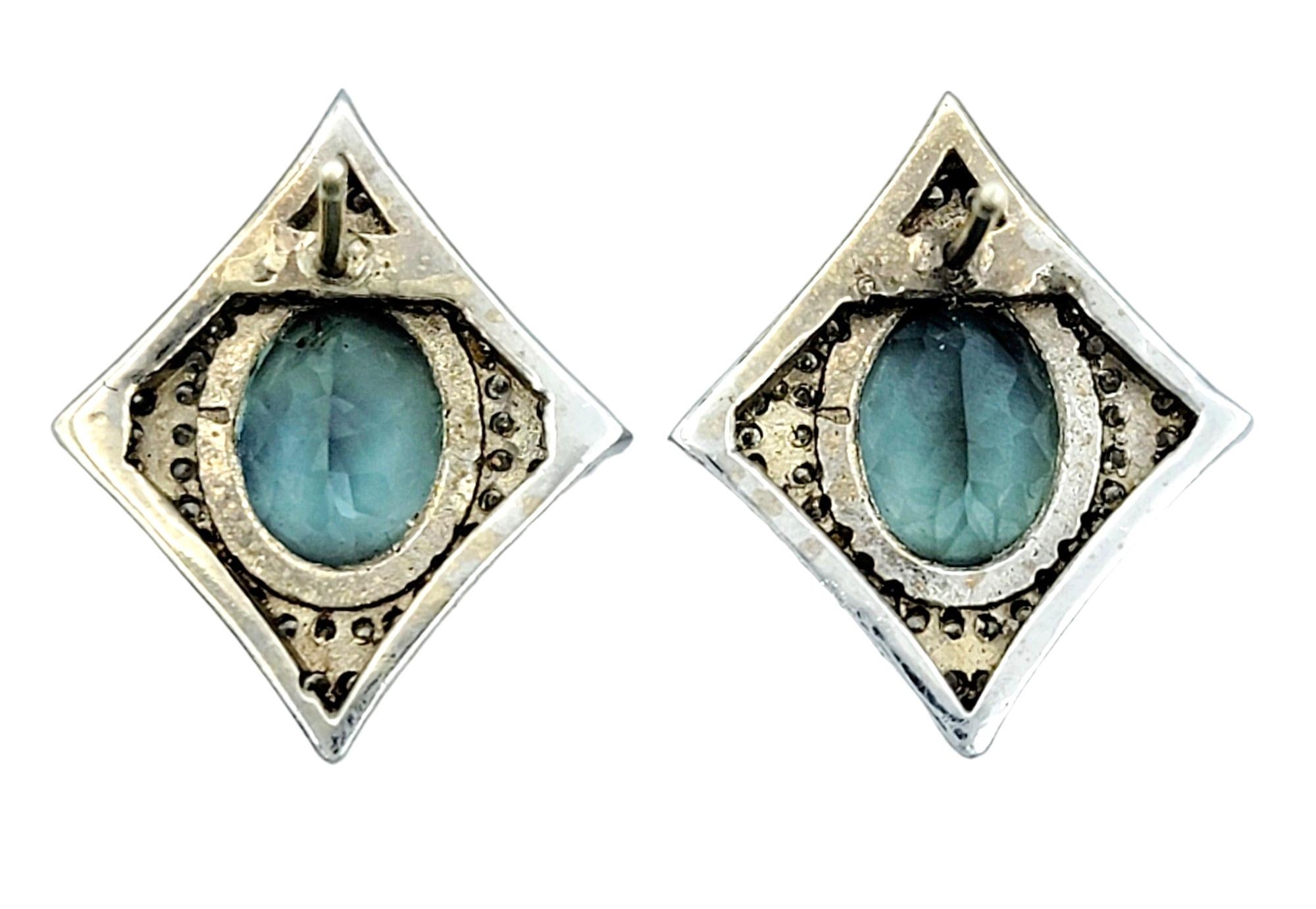 Oval Cut Oval Sapphire and Pavé Diamond 4 Point Star Stud Earrings in 14 Karat White Gold For Sale