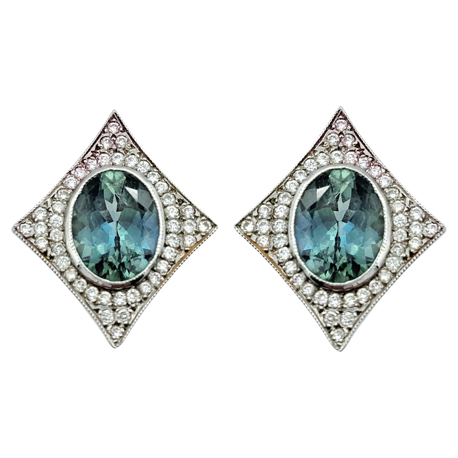 Oval Sapphire and Pavé Diamond 4 Point Star Stud Earrings in 14 Karat White Gold