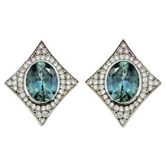 Oval Sapphire and Pavé Diamond 4 Point Star Stud Earrings in 14 Karat White Gold