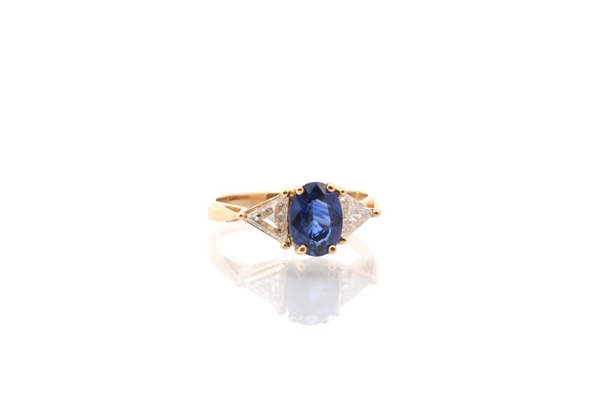 Oval Cut Oval sapphire and triangle diamonds ring For Sale
