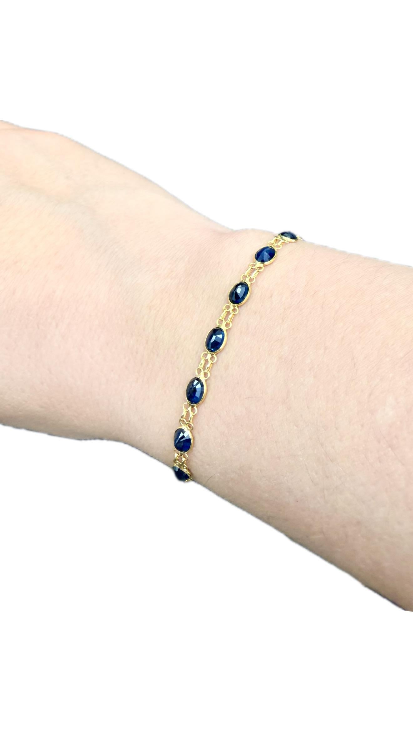 Oval Sapphire Bracelet in 18k Yellow Gold

Elegant and refined, this sapphire bracelet features a continuous line of richly saturated dark blue natural sapphires, each beautifully oval-cut to enhance its depth of color and brilliance. Crafted in