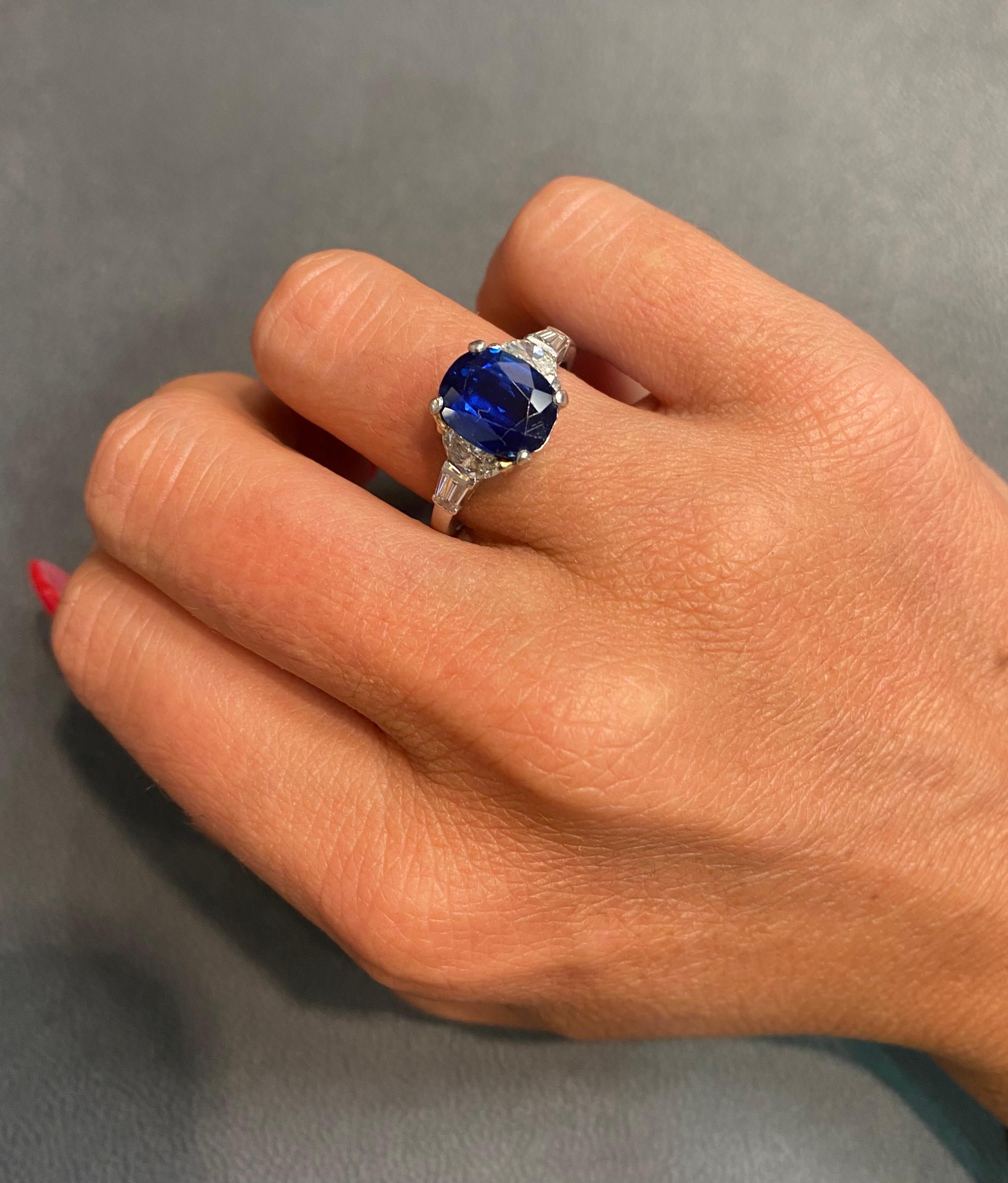Oval Sapphire & Diamond Ring

A platinum ring set with an oval cut sapphire, 2 half moon cut diamonds, and 2 baguette cut diamonds

Accompanied by an AGL report stating that the sapphire is of Thai origin and is heated

Stamped Fougeray and 10% IRID