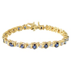 Bracciale tennis con zaffiro ovale e diamanti in oro giallo 14k