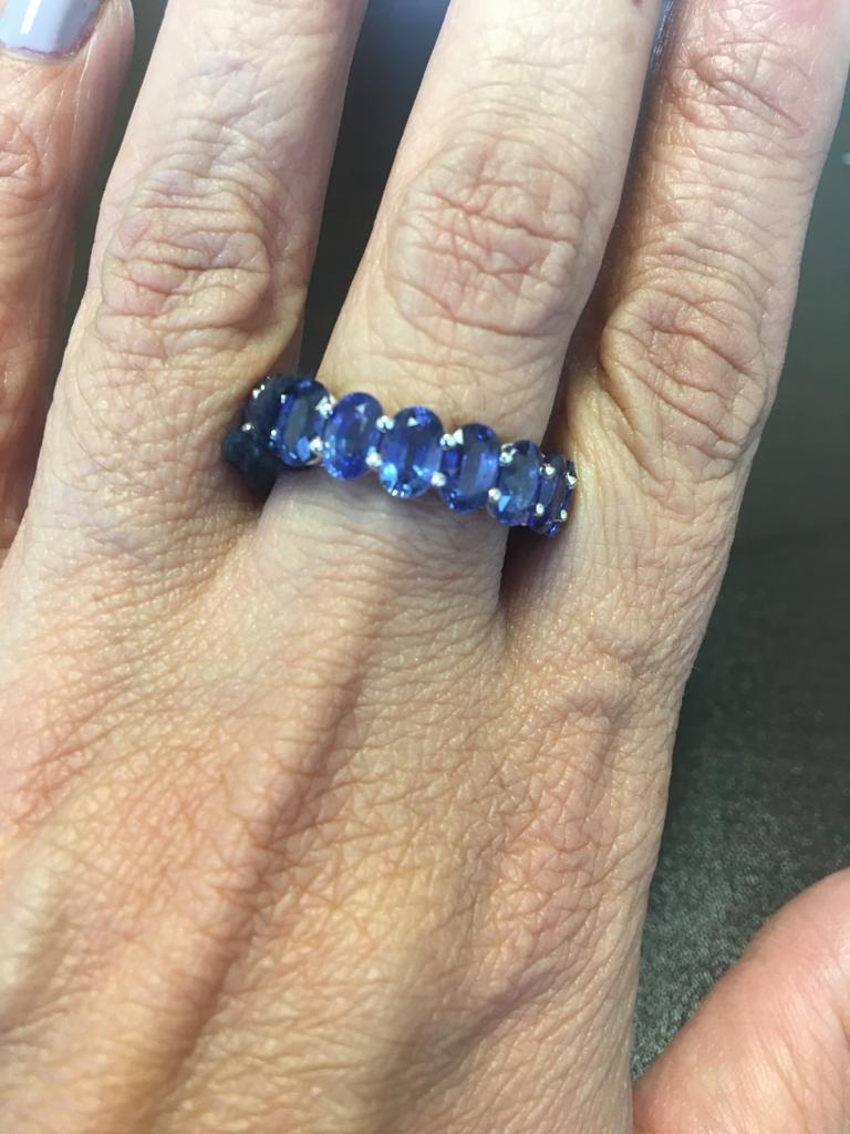 This stunning eternity band is made of 18 perfectly matched oval stones. The superb quality of this Ceylon sapphires make this ring a unique piece. The ring is set in 18K white gold, and the total weight of the ring is 12.45 carats. The size of the
