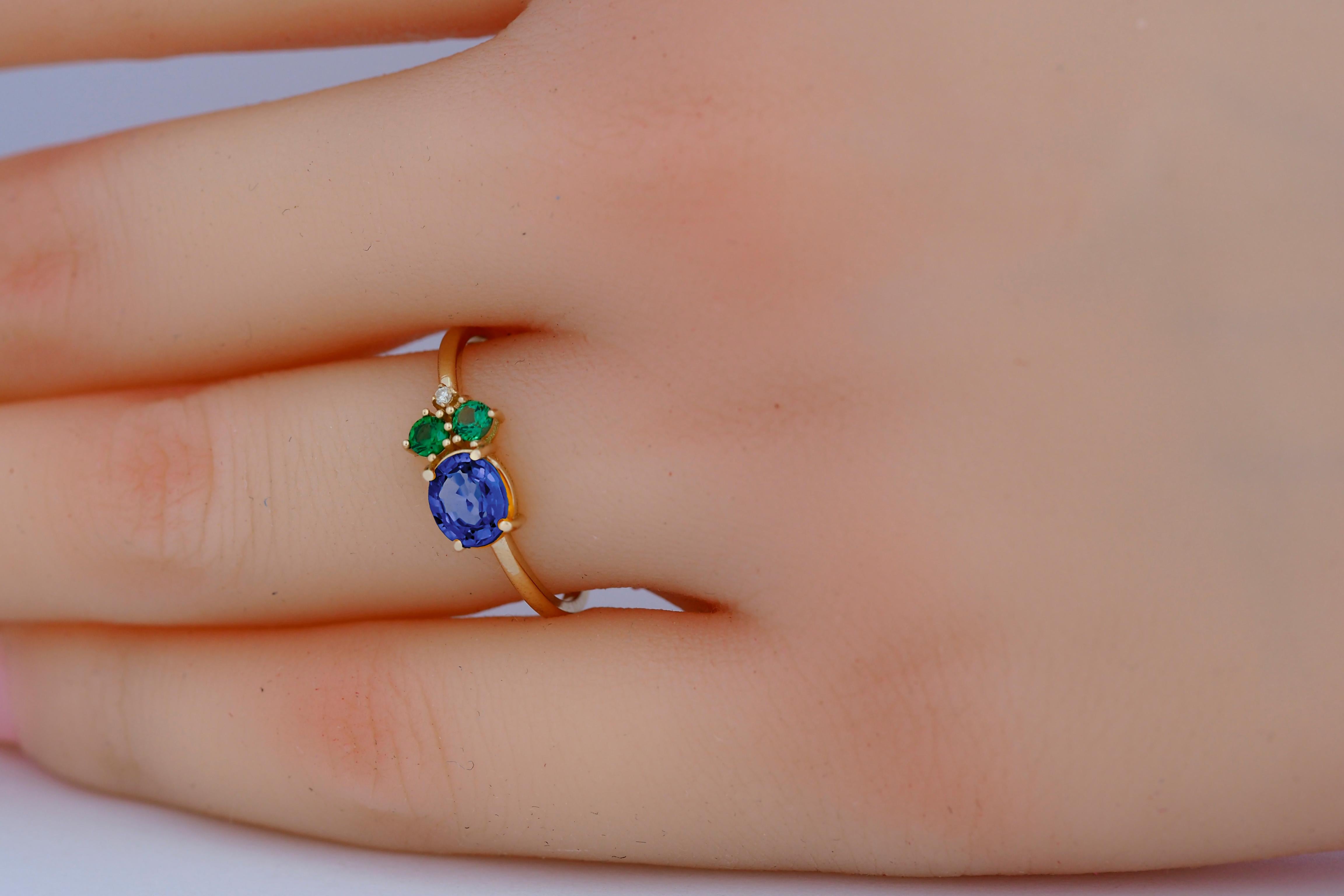 Oval sapphire, tsavorite and diamonds 14k gold ring.
Blue sapphire gold ring. Sapphire cluster ring. Sapphire engagement ring.

Metal: 14k gold
Weight: 1.8 gr (depends from size)

Gemstones:
Set with sapphire color - blue
Oval cut, aprox 0.80