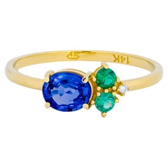 Used Oval sapphire, tsavorite and diamonds 14k gold ring.