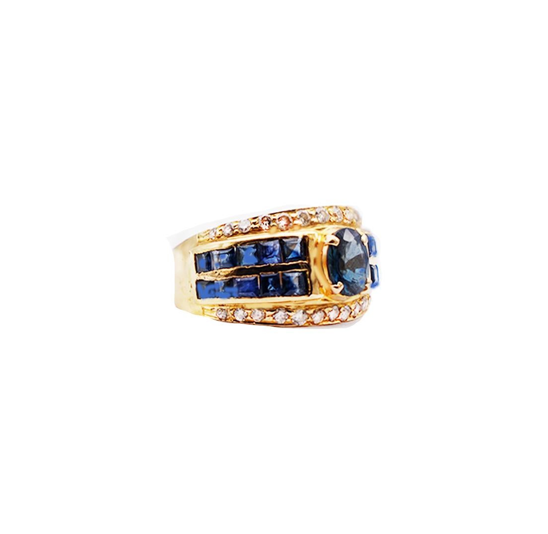 Contemporary Oval Sapphire with Princess Channel and Diamond 18 Karat Band Ring For Sale